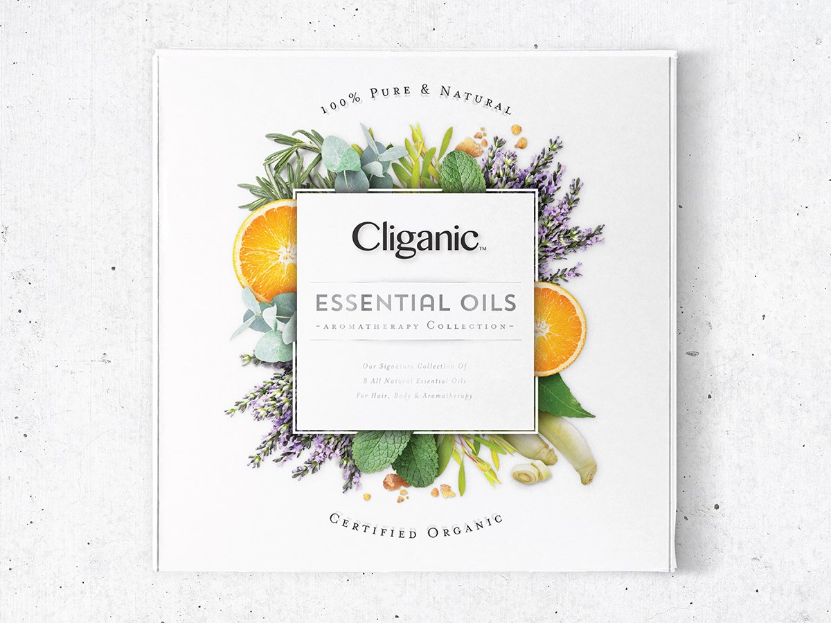 Cliganic Essential Oils Aromatherapy Collection gift box surrounded by botanicals