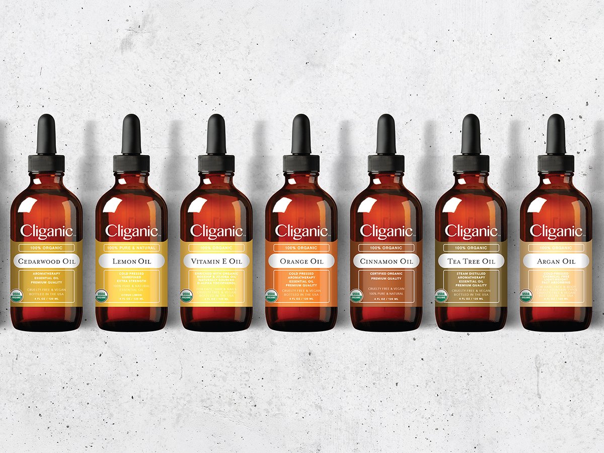 Cliganic essential oil bottles including Cedarwood, Orange, and Argan