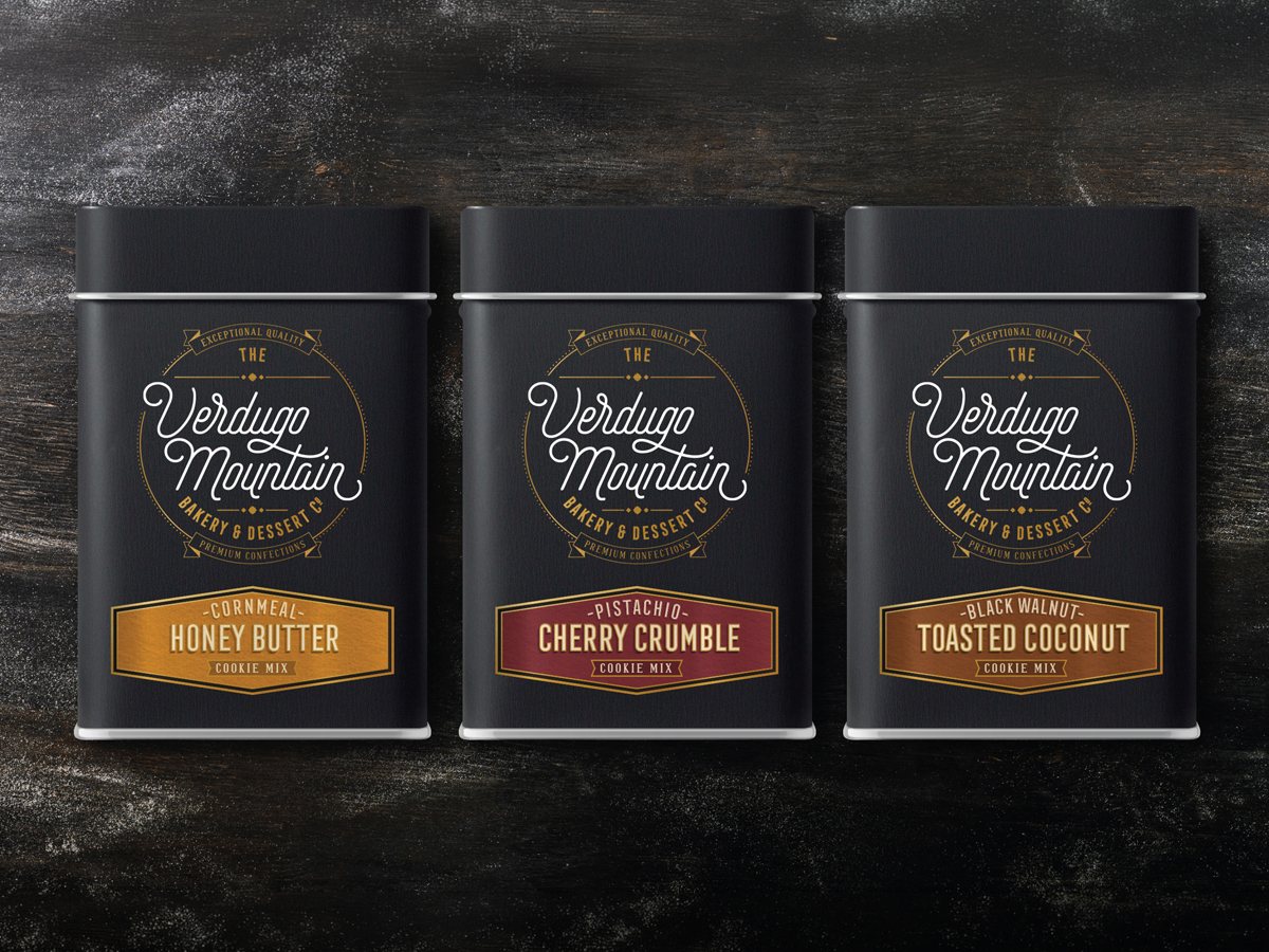 The Verdugo Mountain Bakery everyday cookie mix tins in black packaging