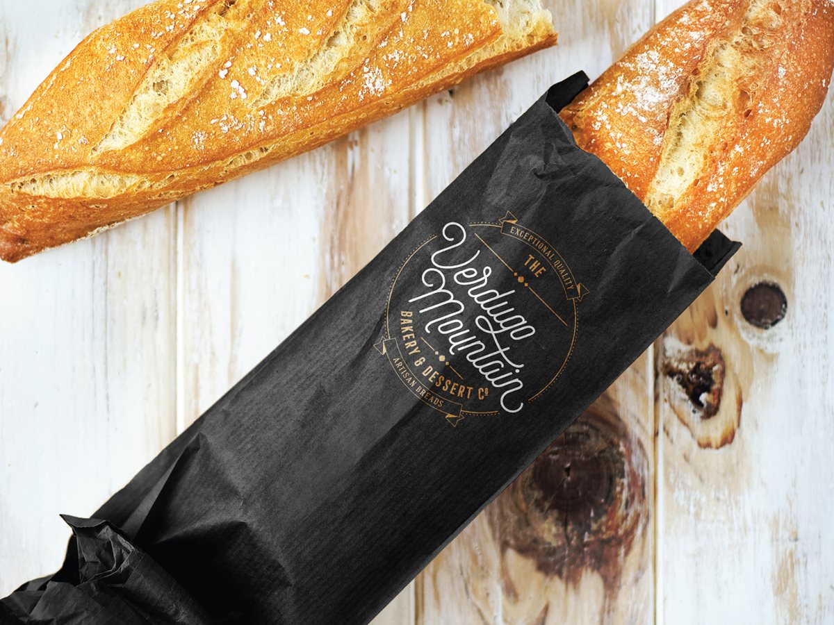 The Verdugo Mountain Bakery black kraft bread bag with baguettes